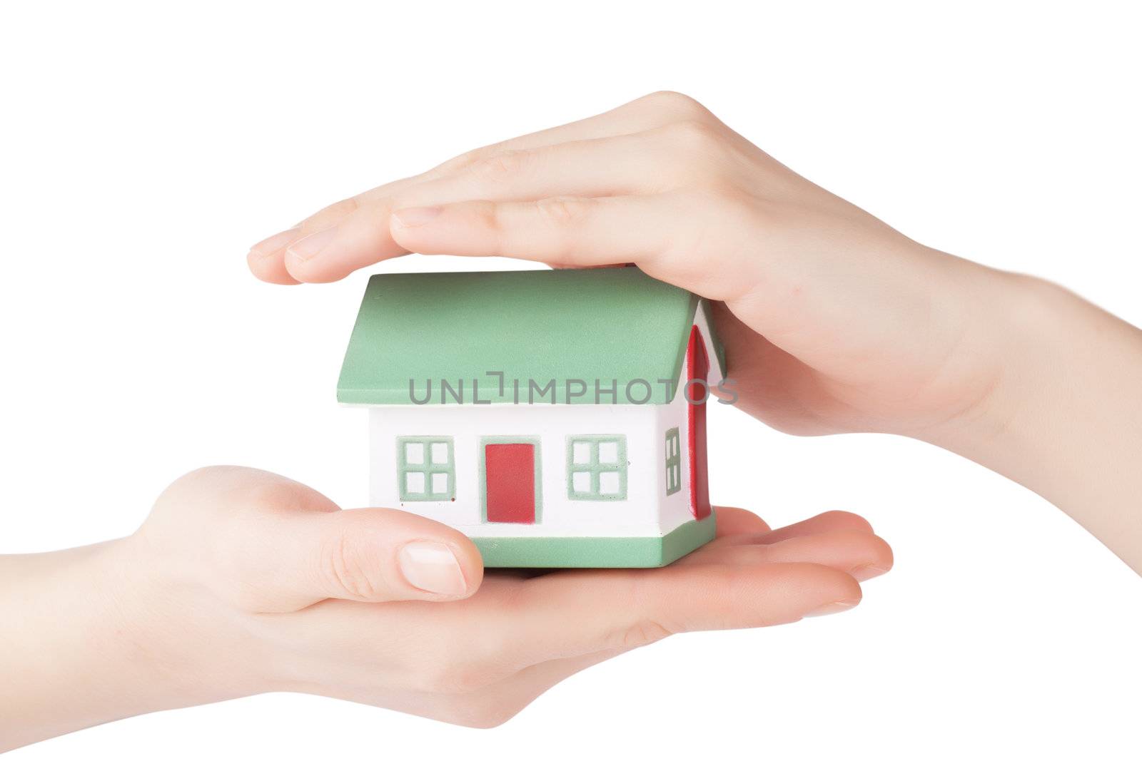 Little house toy in hands isolated over white background