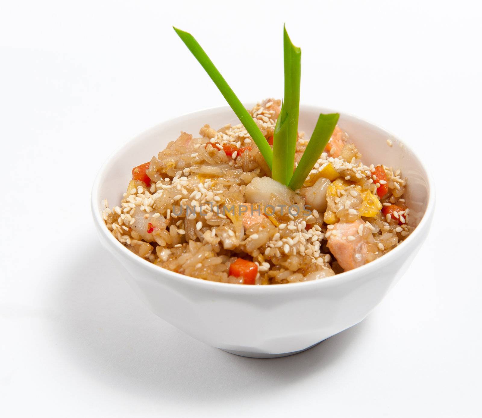 Fried rice with seafood in soy sauce isolated on white