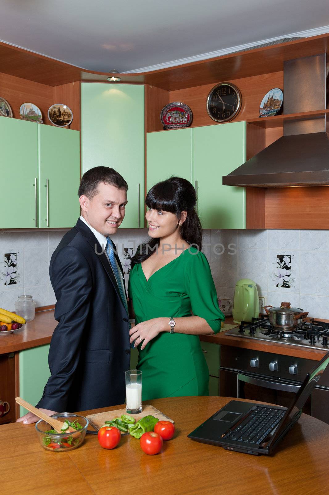 Portrait of a Happy couple preparing food in the kitchen