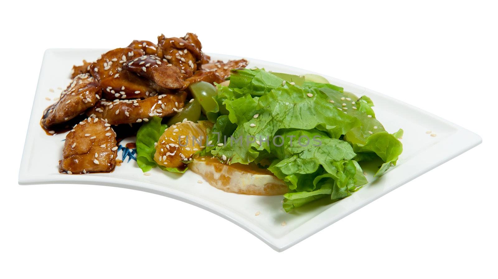 pieces of chicken in sauce with salad isolated on white background