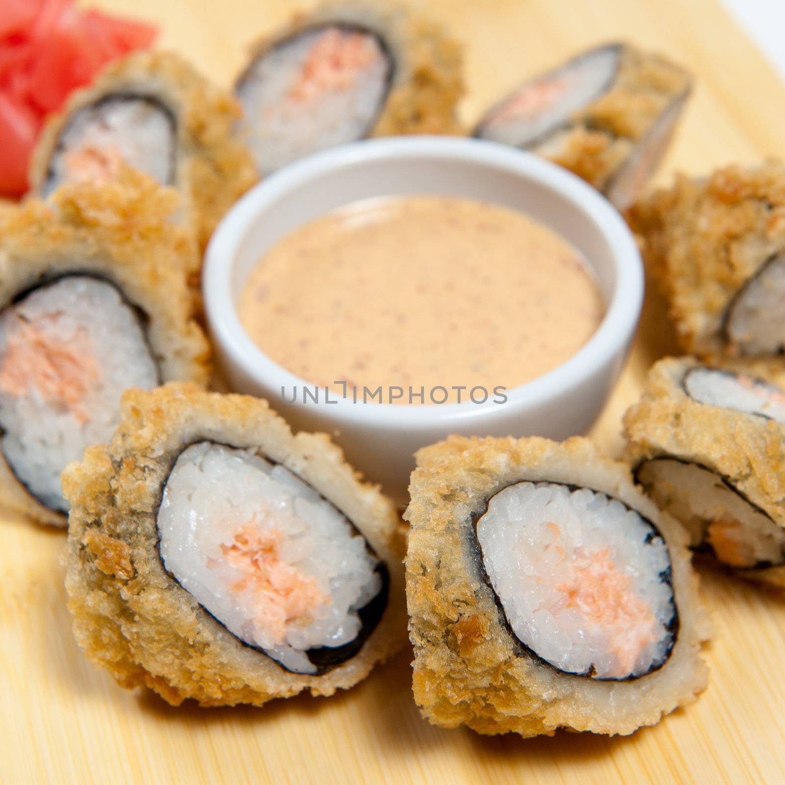 Sushi on wooden stand isolated on white background