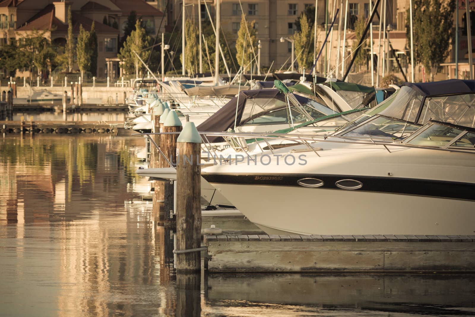 Boats and reflections of yachts in still water