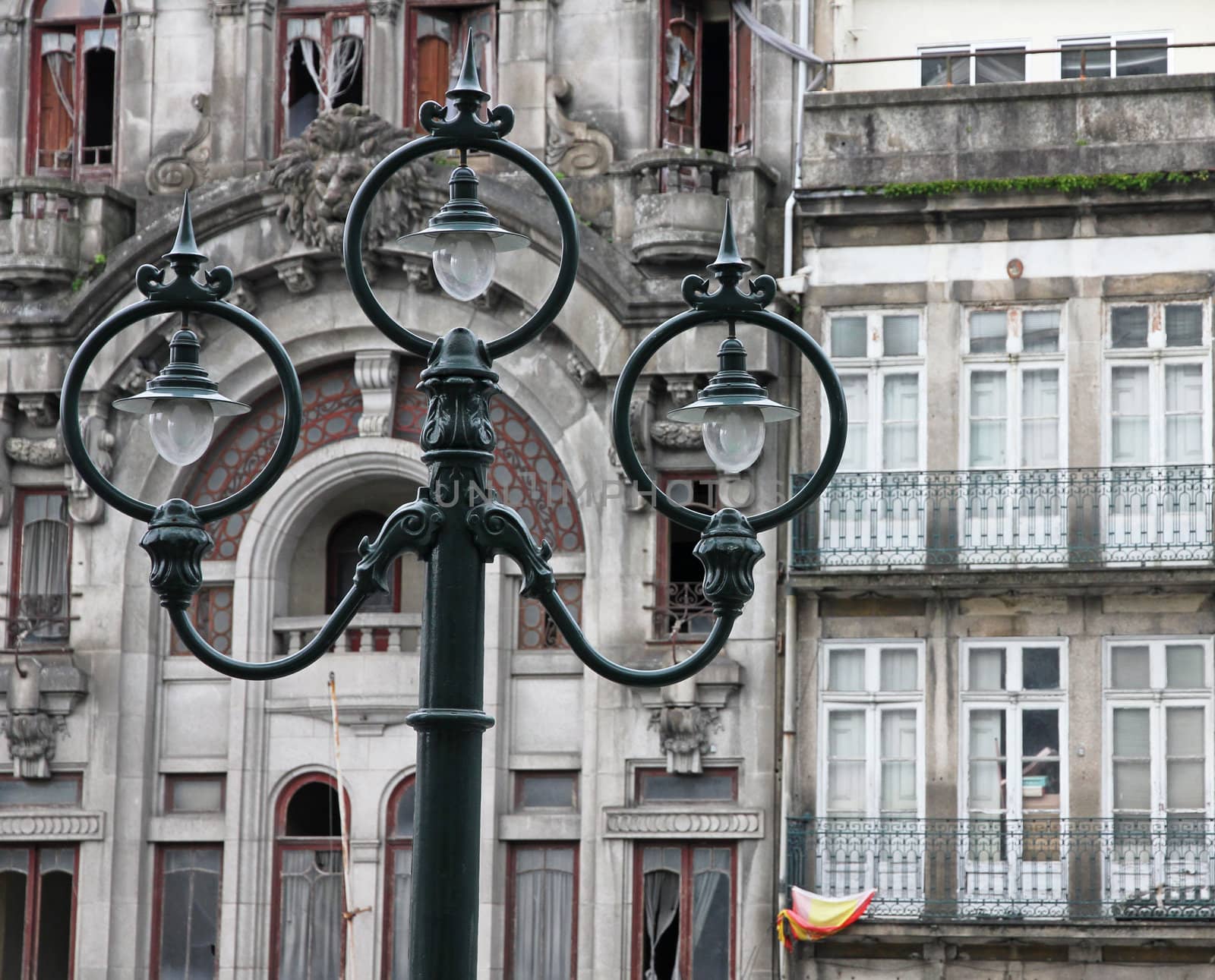 Portugal. Porto city. Ancient lantern opposite old house