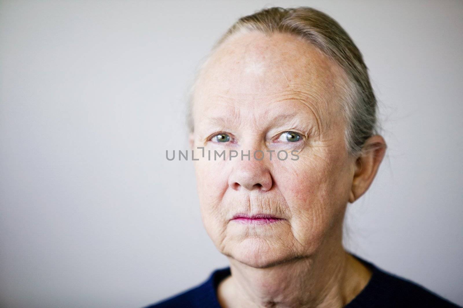 Portrait of a senior woman looking towards the camera.