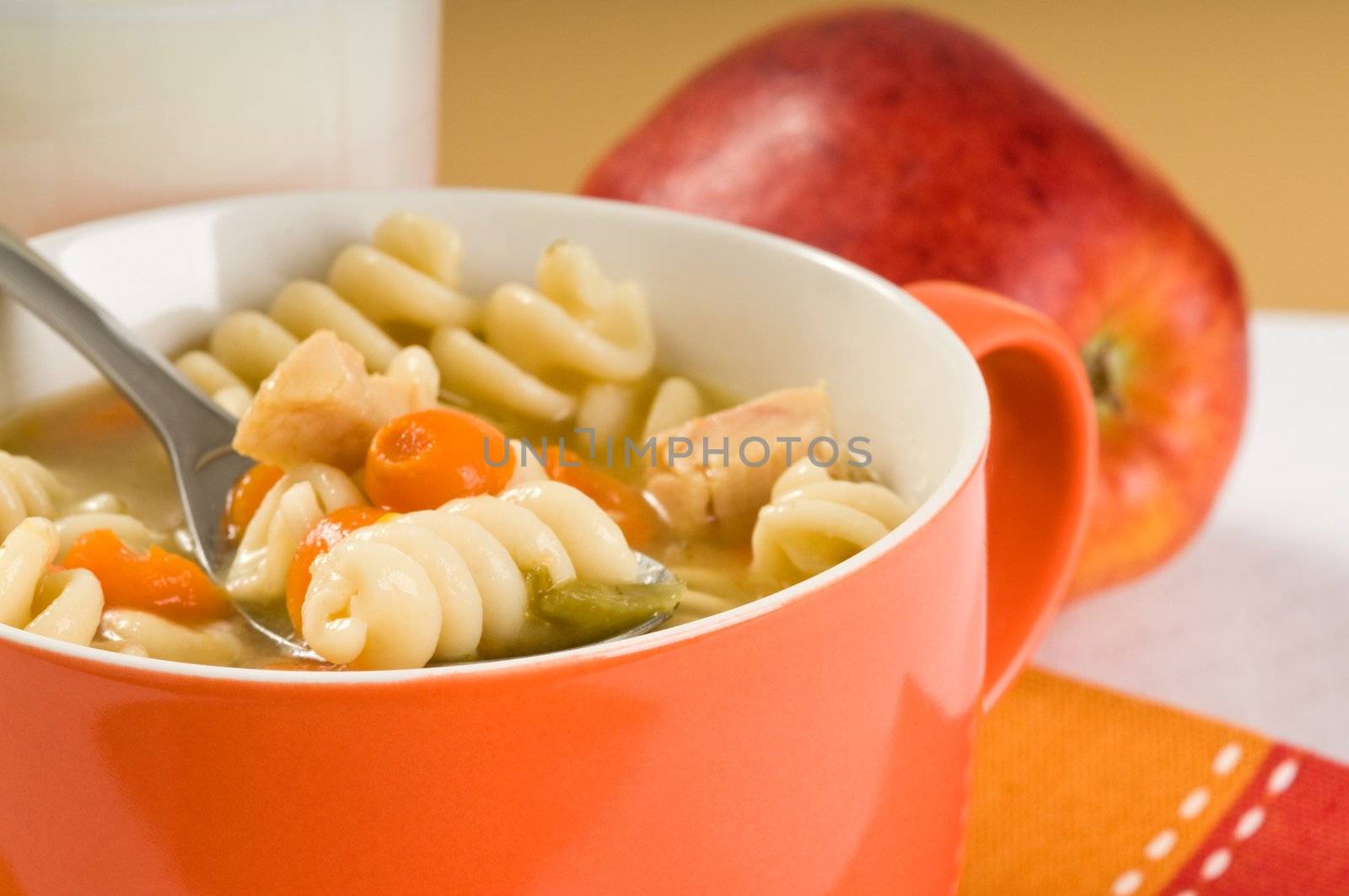 Spoon full of healthy homemade chicken soup.