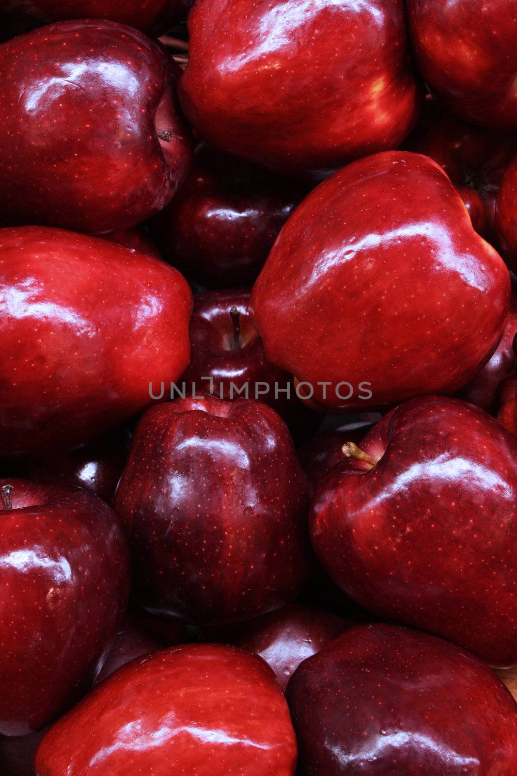 A pile of red apples at a farmers market