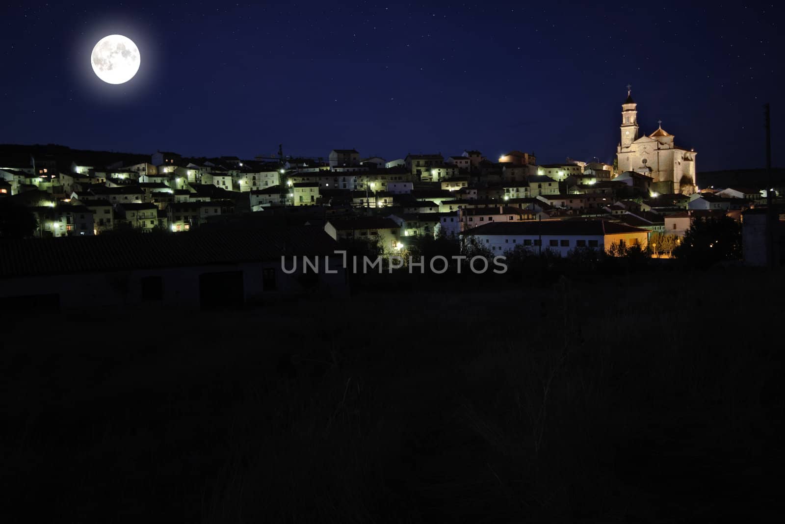 Village with cathedral under the light moon. 
Canon 40D 17-55mm f:2,8