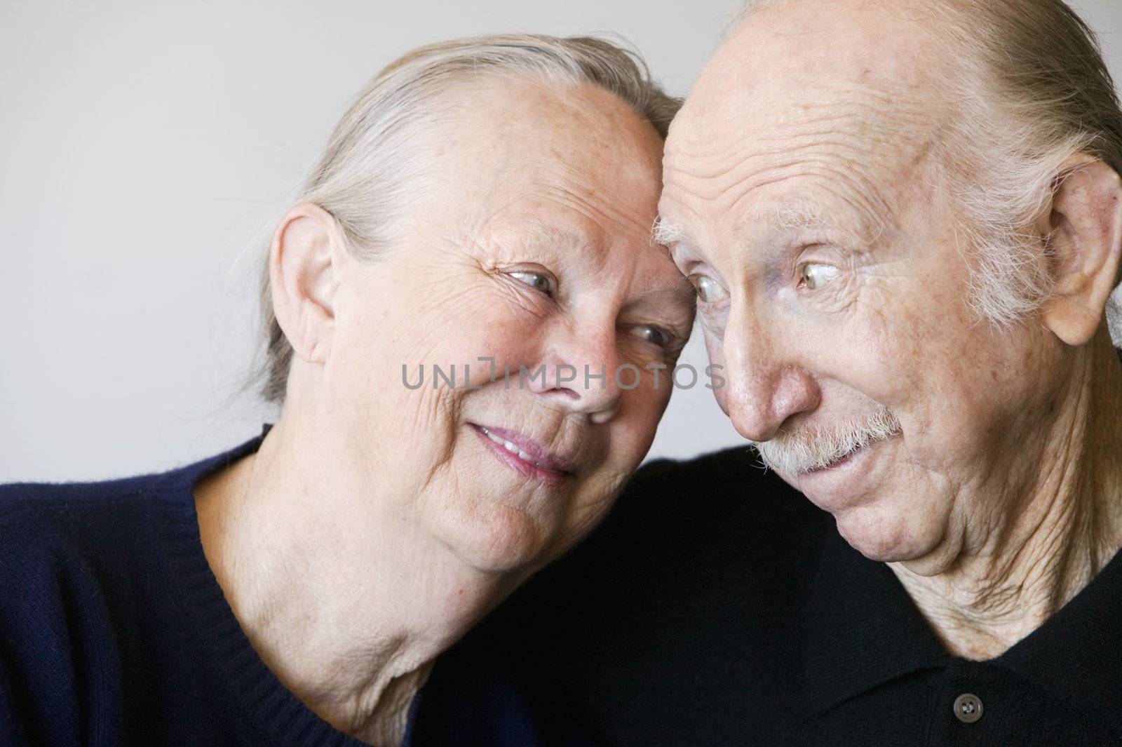 Close-up of senior couple embracing