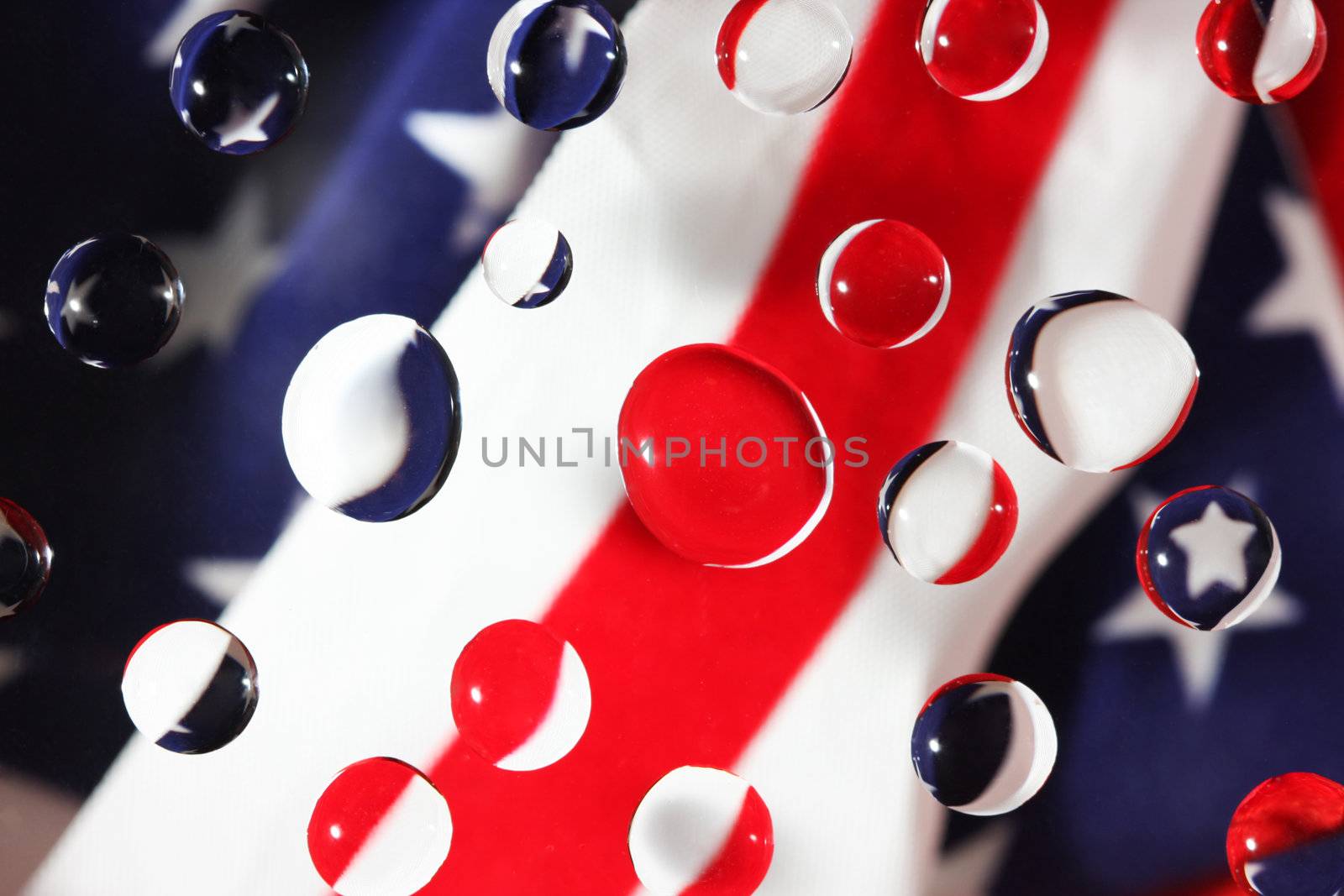 the colors of the the US flag focused in water drops, great abstract background