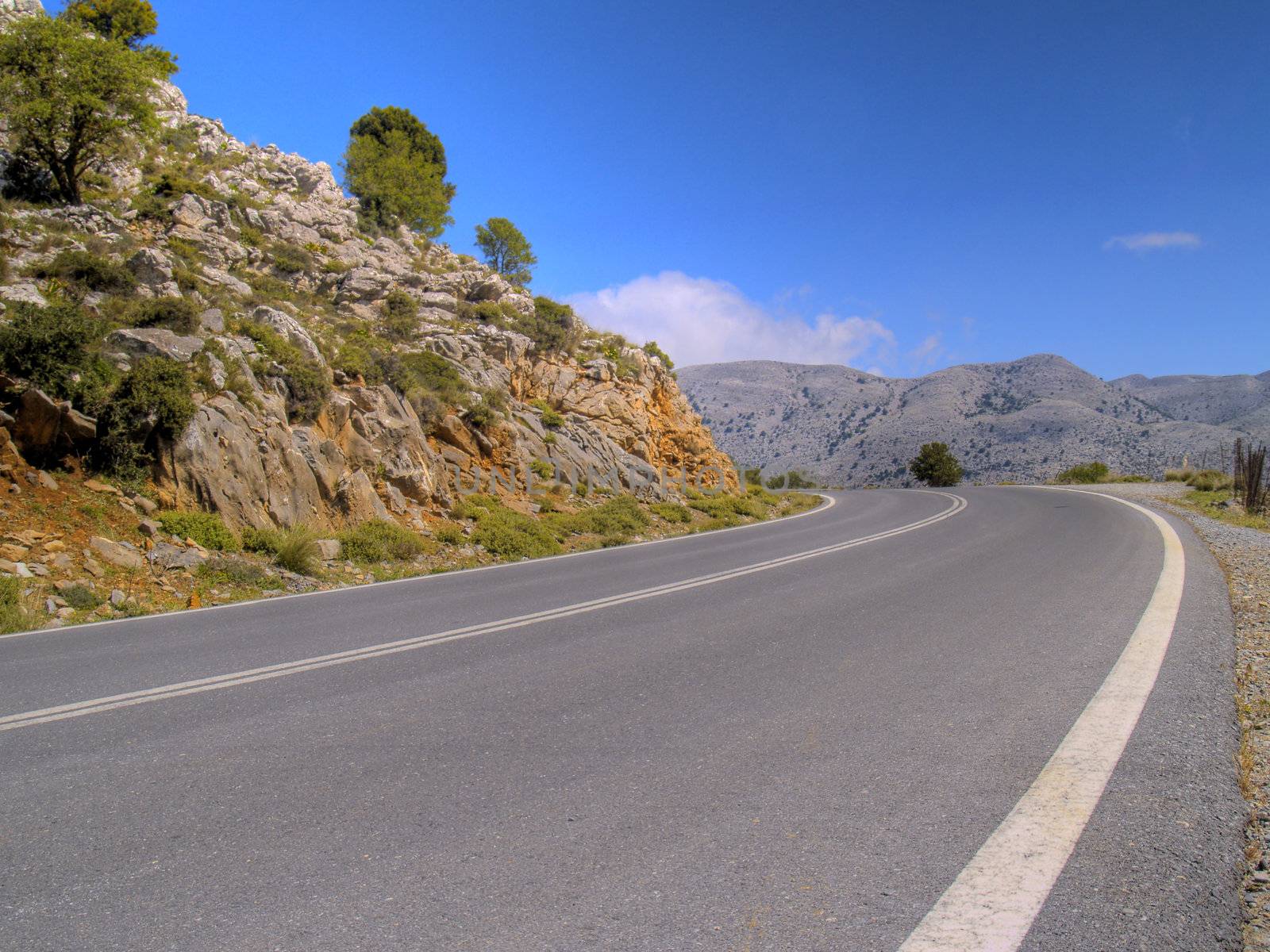 road in cretan mountains on a bright sunny day