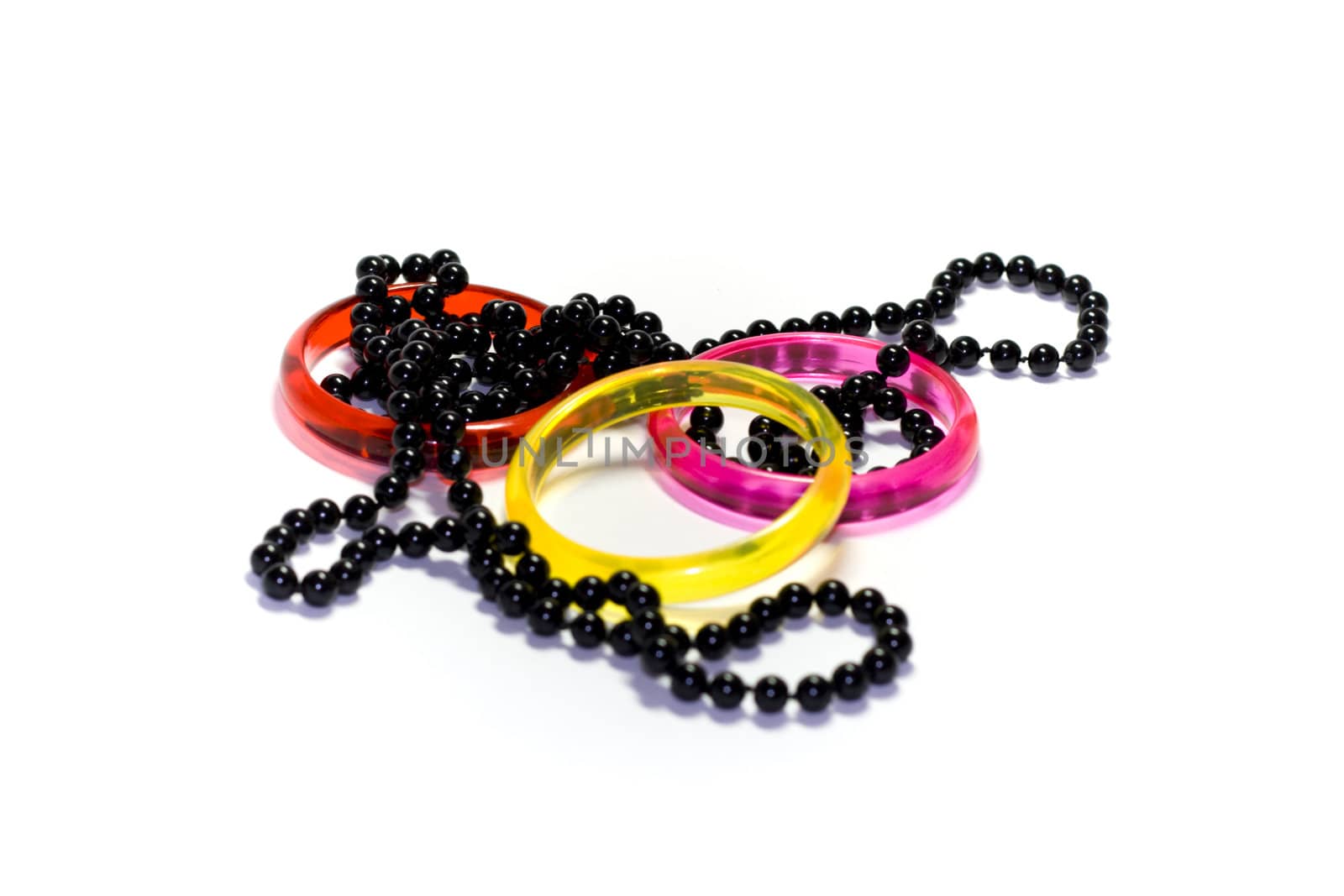 Three colour rings and black round necklace