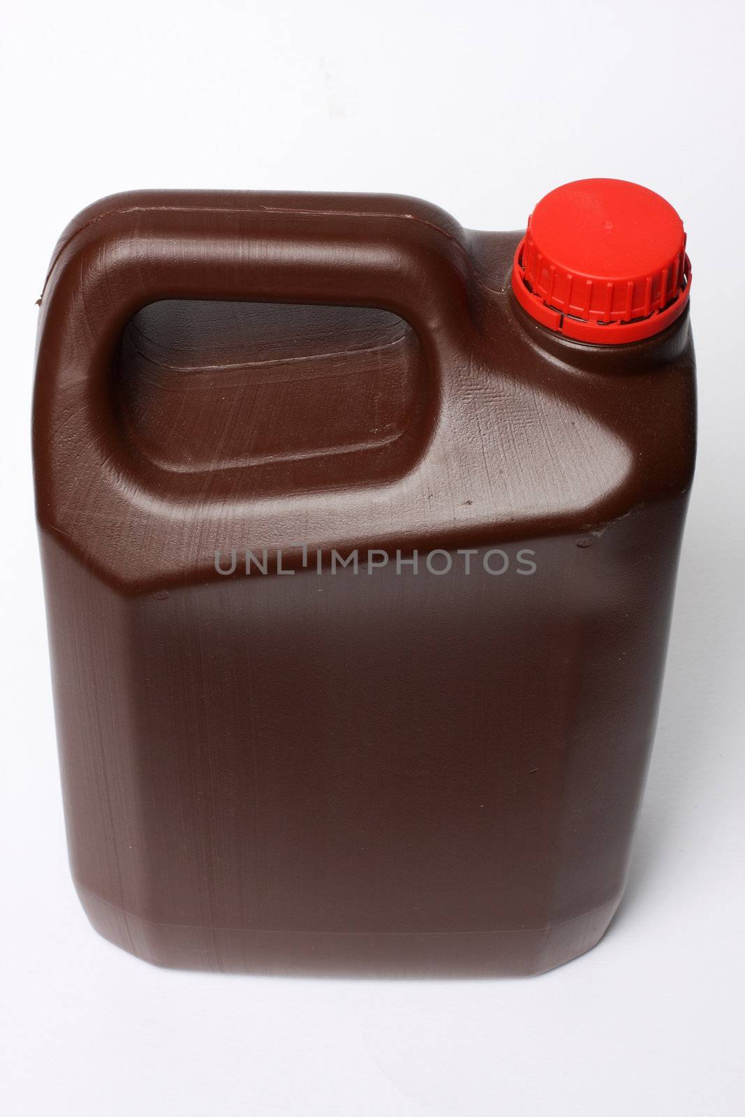 brown oil can isolated on white shot from the side and slightly from the side