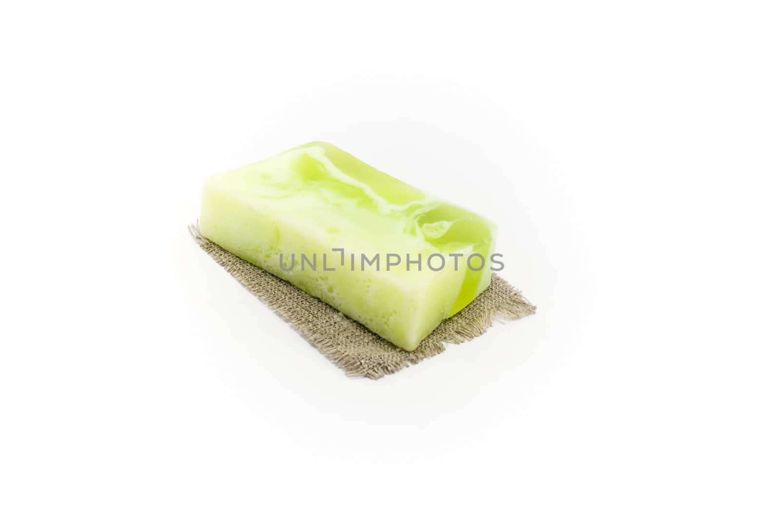 Fruit soap on linen lining insulated on white background