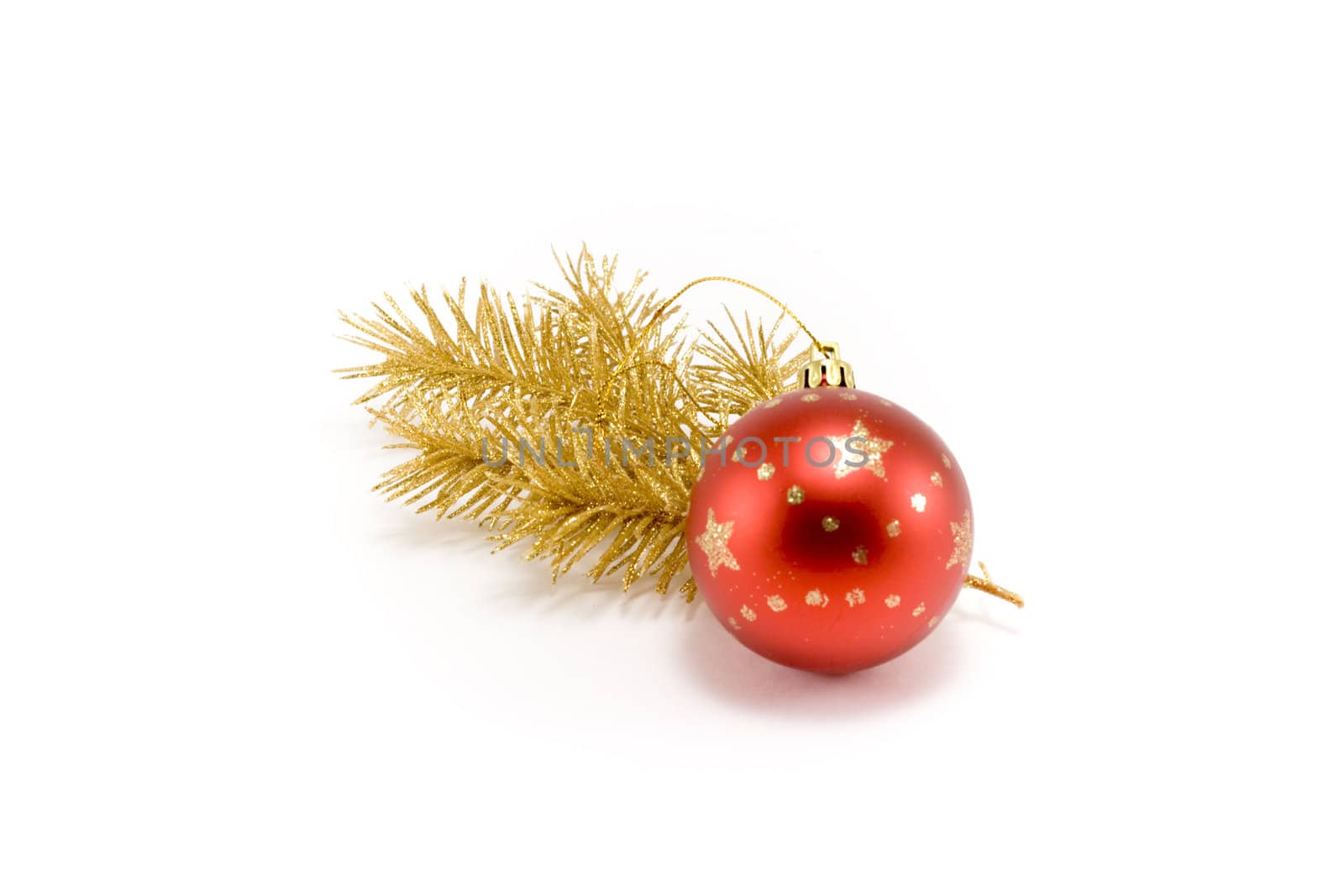 Red ball and gold(en) spruce isolated on white background