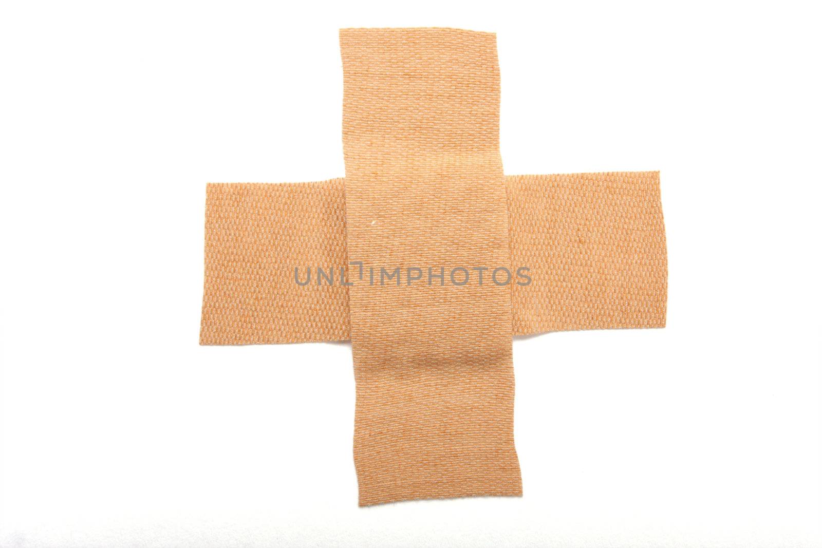 Band aid in a cross isolated on white, great concept of making things better