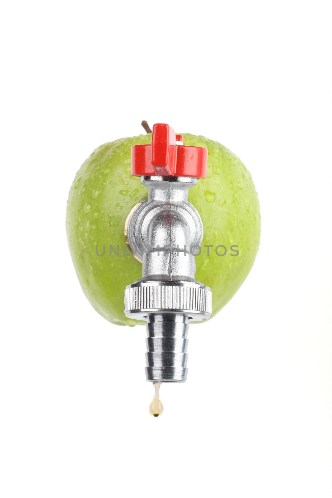 green apple with faucet, drop of apple juice dripping from it, isolated on white