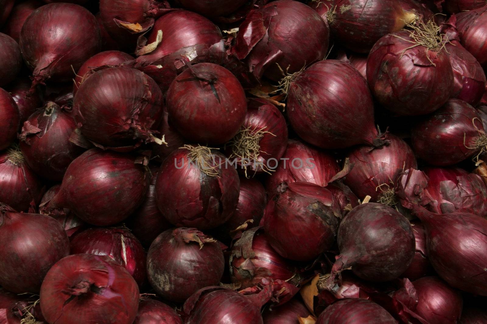 Pile of red onions cropped shot