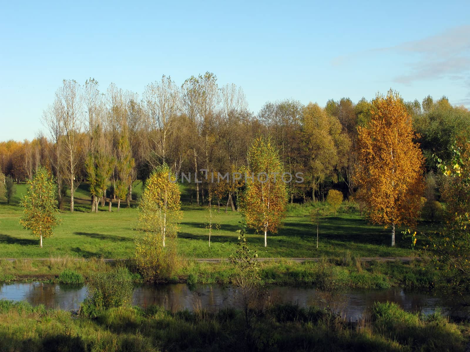 Autumn landscape in park with Yauza-river, Moscow