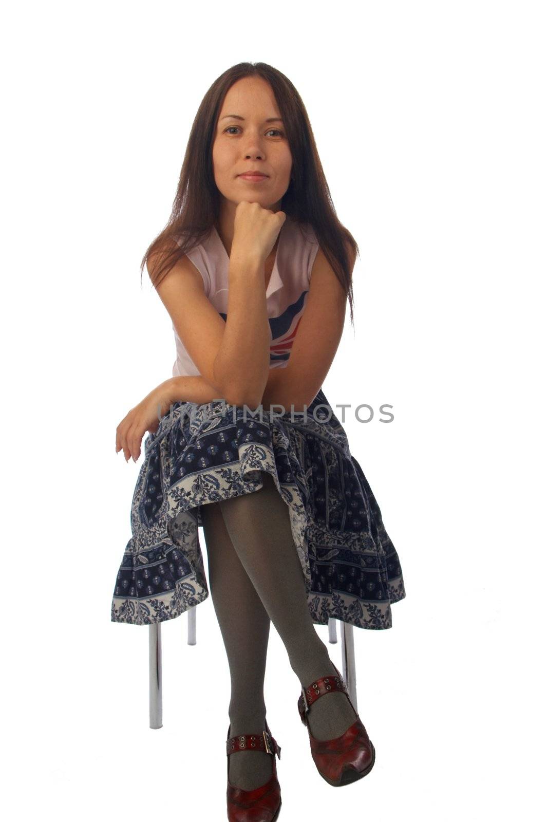 Young woman is sitting on the chair by Grachev