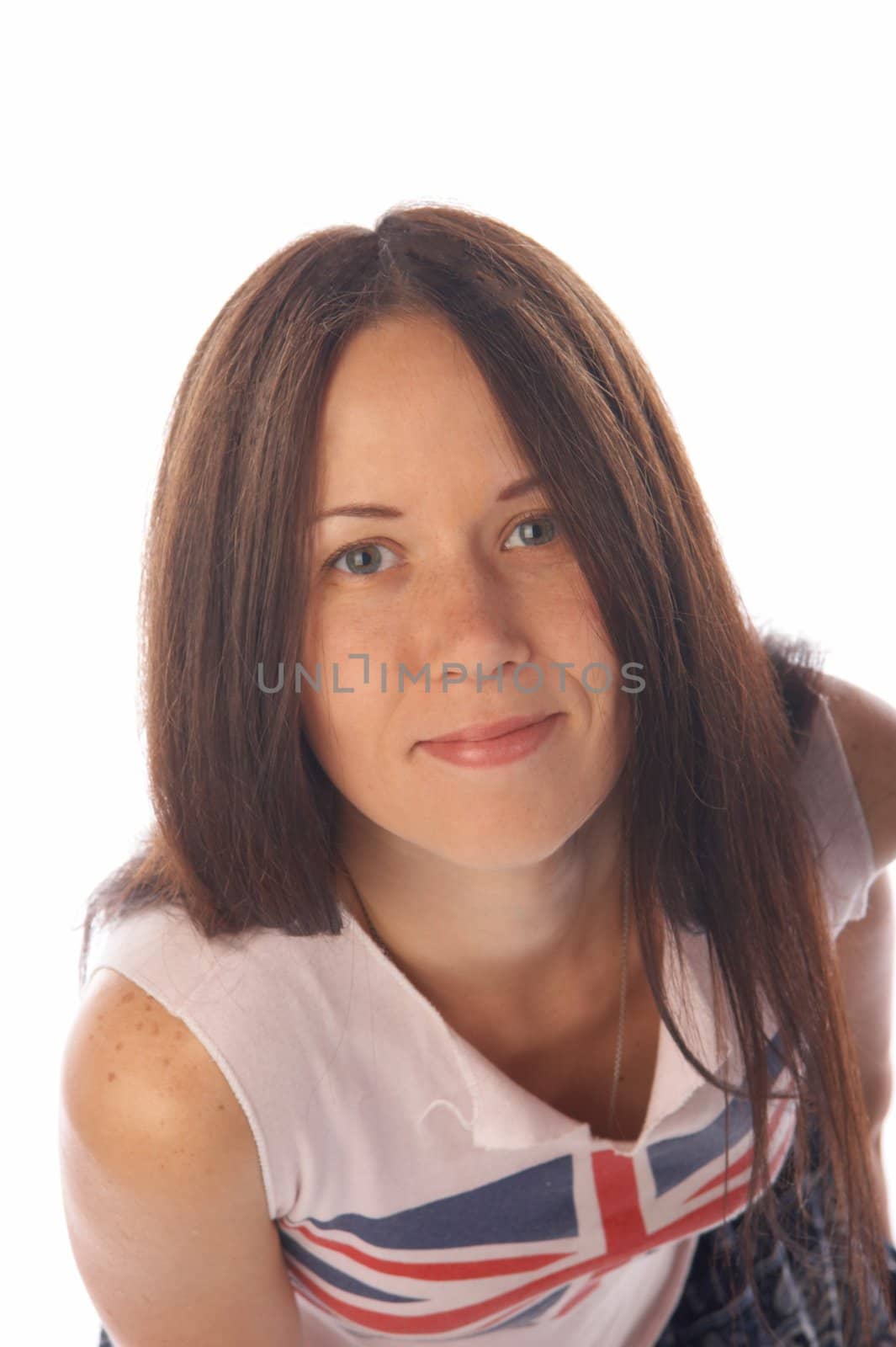 Pretty dark haired young woman in tank top smiles us