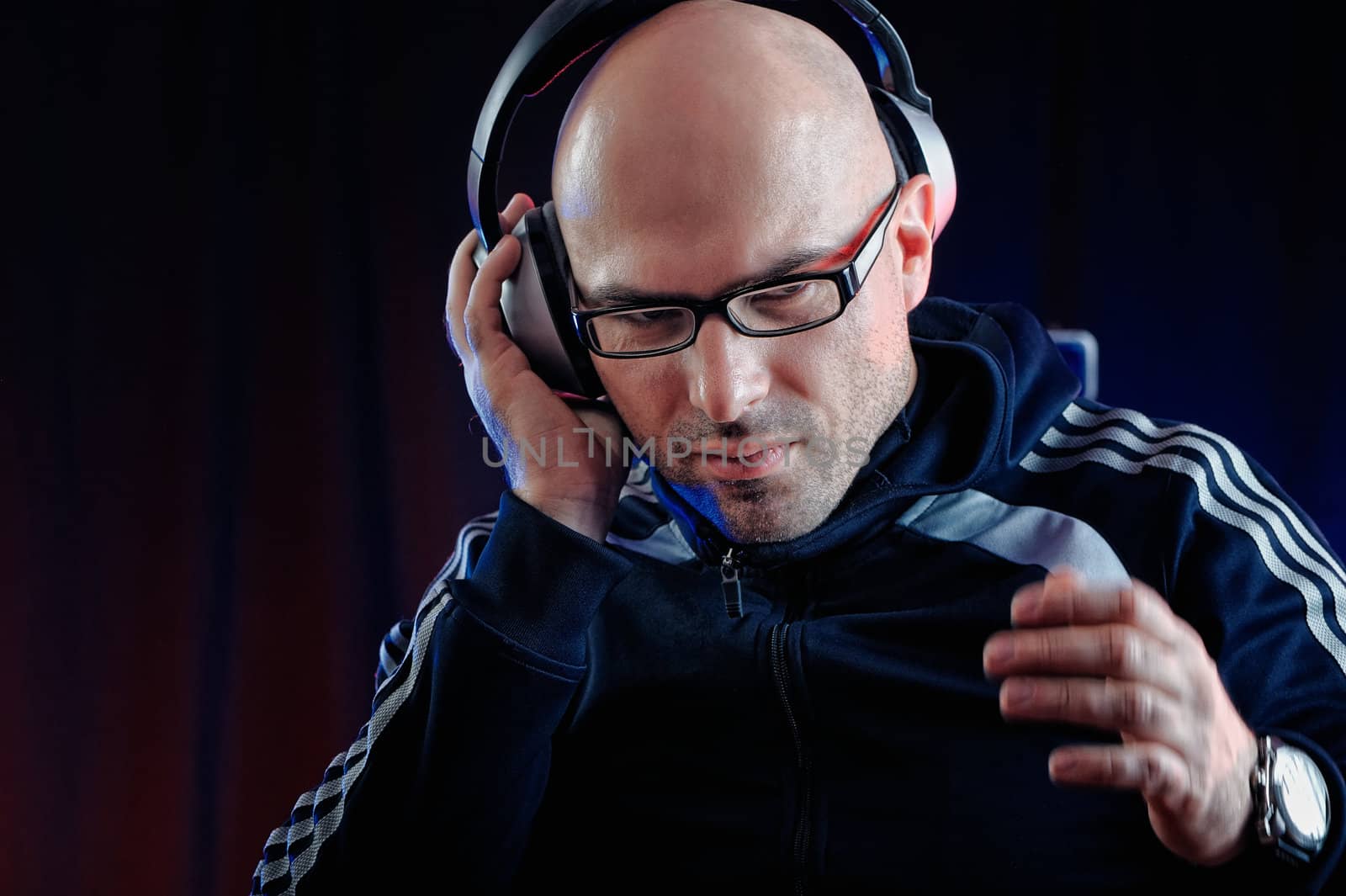 Man listening to music on headphones in studio