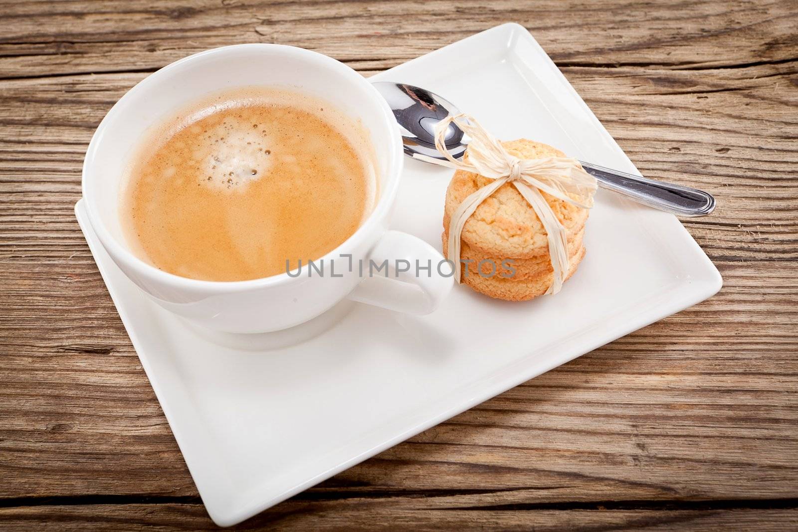 fresh aromatic coffee and cookies on wooden table 