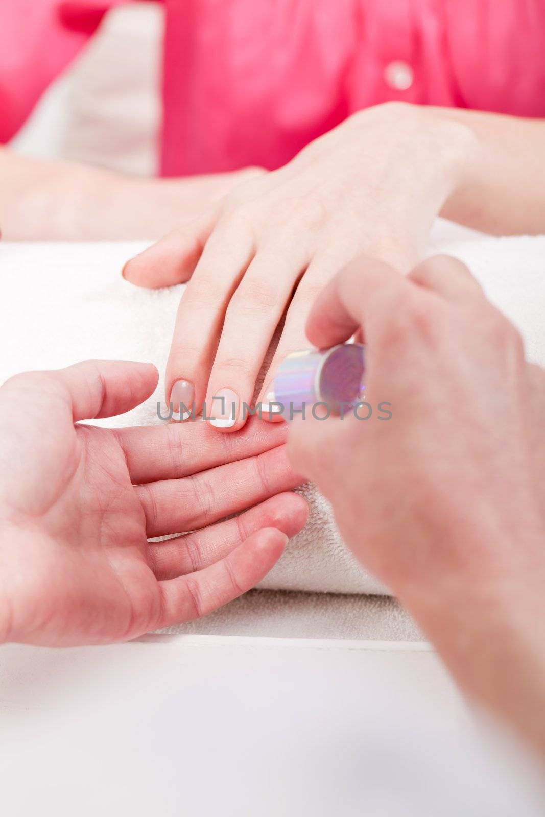professional manicurist doing a manicure natural look 