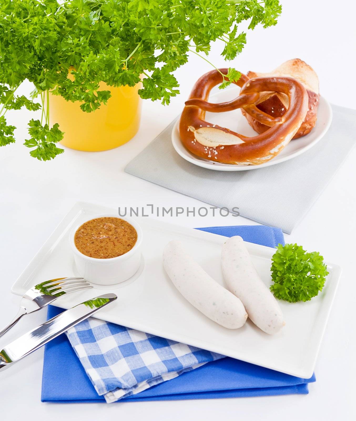 weisswurst white sausages and sweet mustard with pretzel  bavarian traditional food