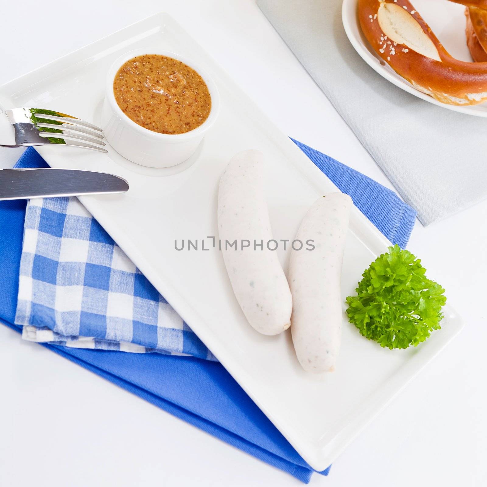 weisswurst white sausages and sweet mustard with pretzel  bavarian traditional food