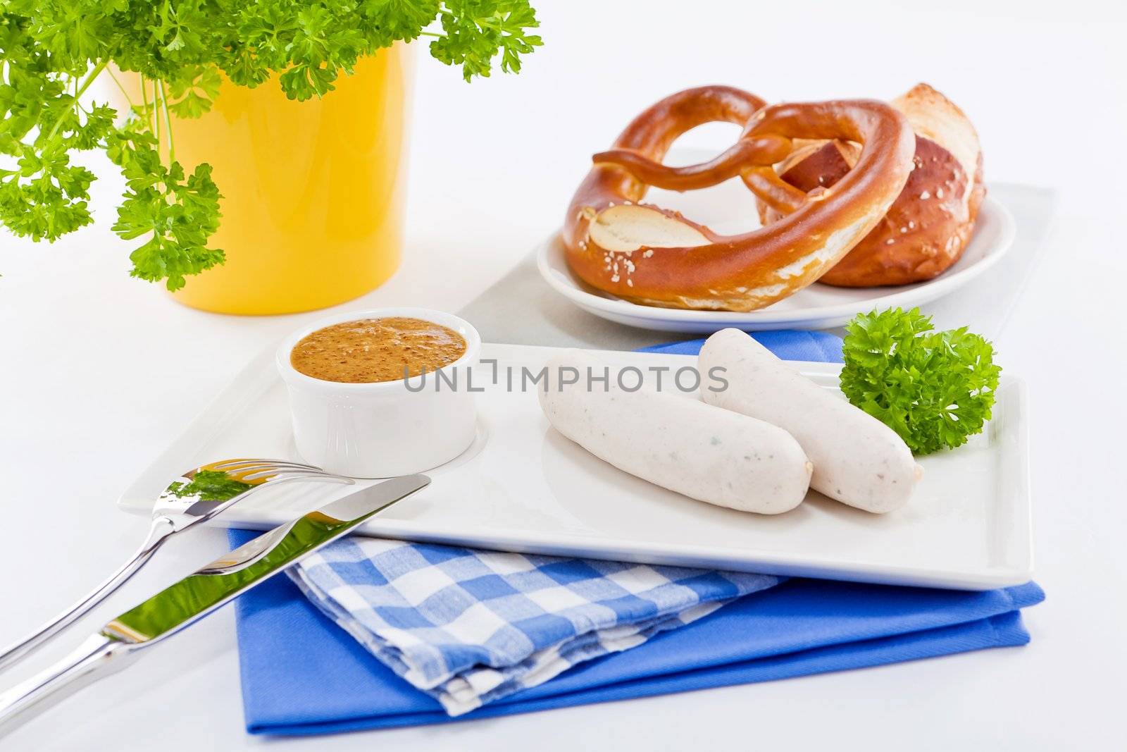 weisswurst white sausages and sweet mustard with pretzel  bavarian traditional food