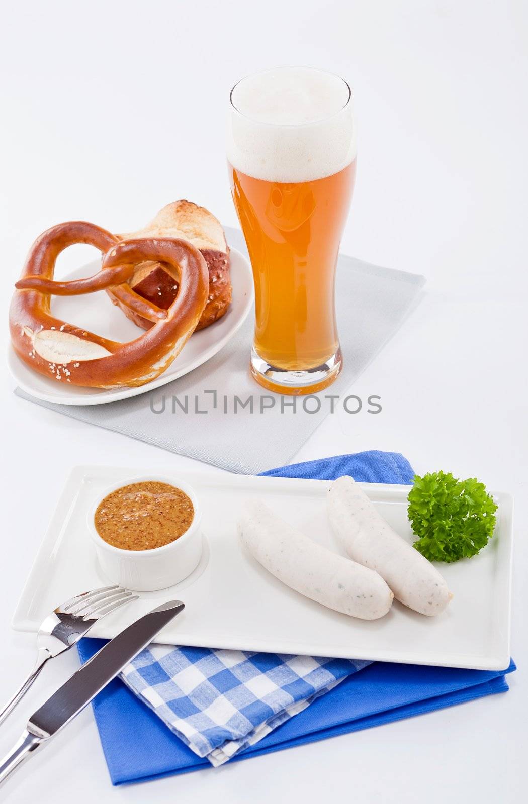 weisswurst white sausages and sweet mustard with pretzel  bavarian traditional food