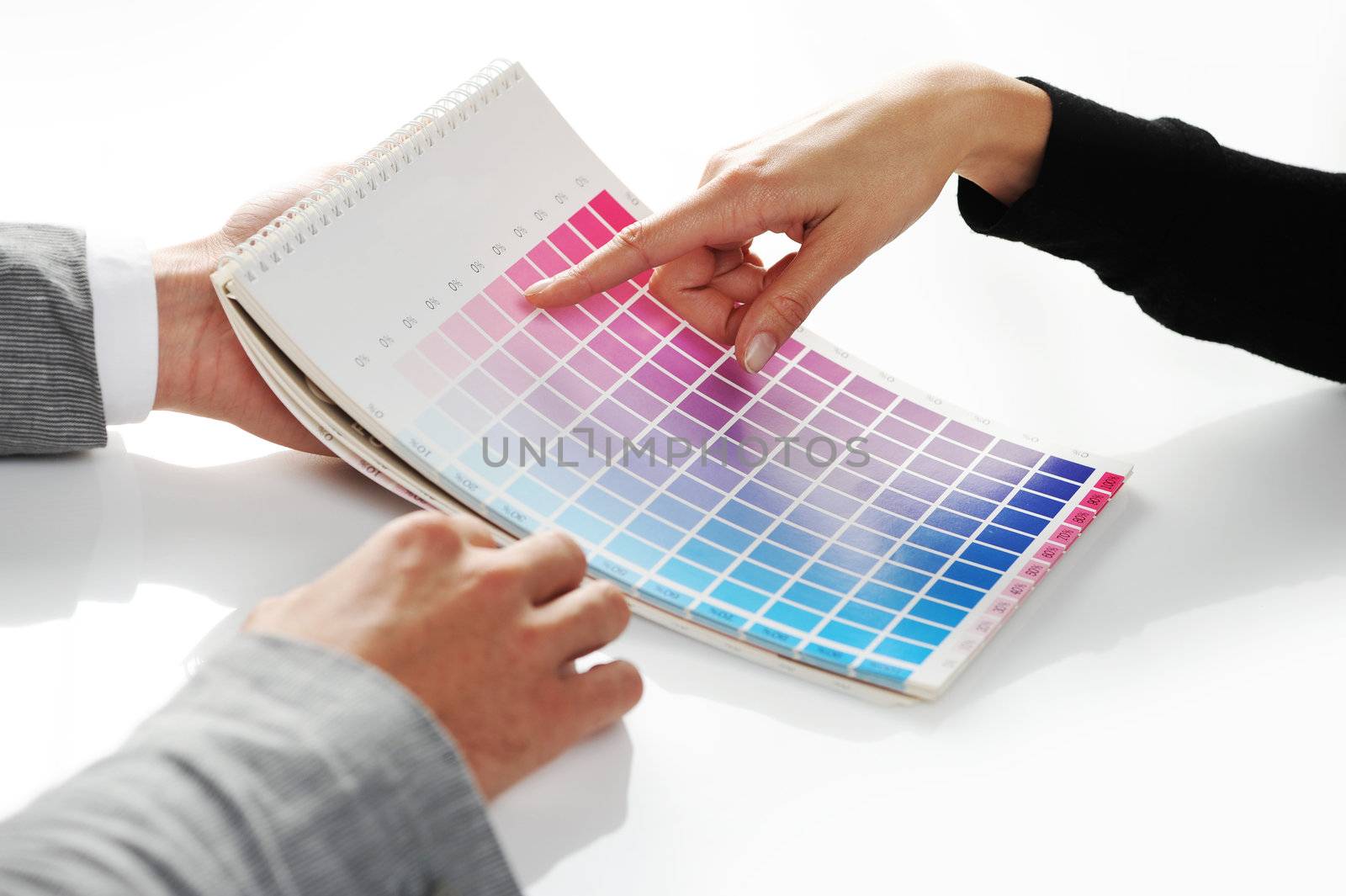 woman Choosing color from color scale by stokkete