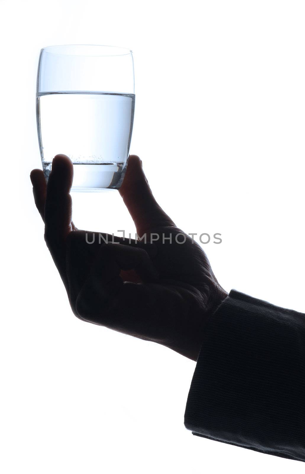 man  with a glass of water, only hand by stokkete