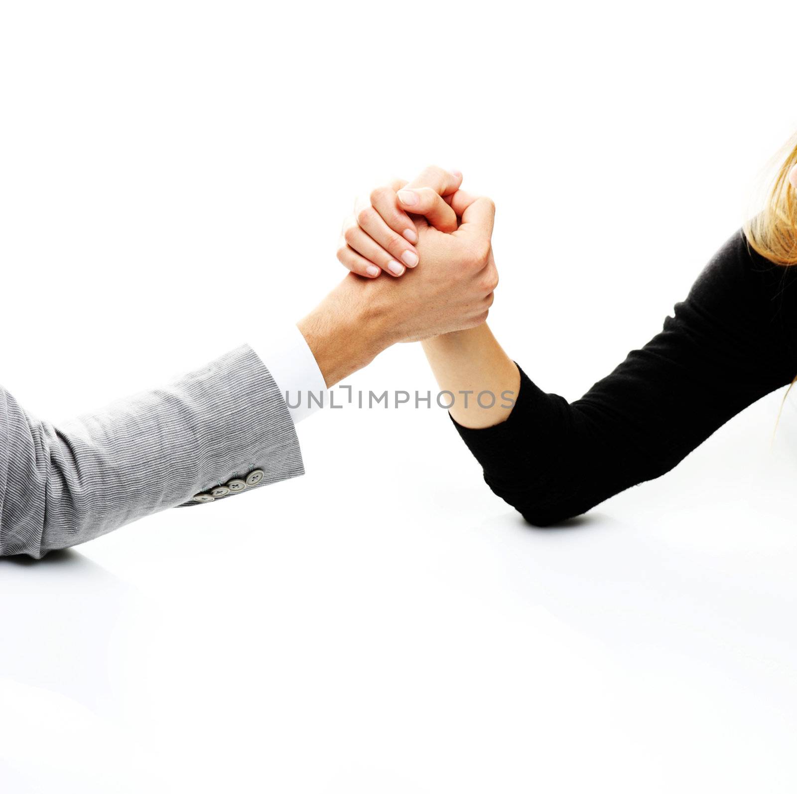 businessman and businesswoman arm wrestling on table. 