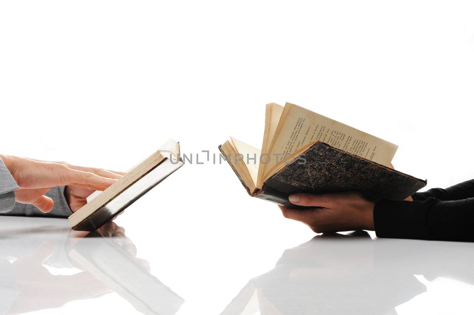 Man and woman reading an old book