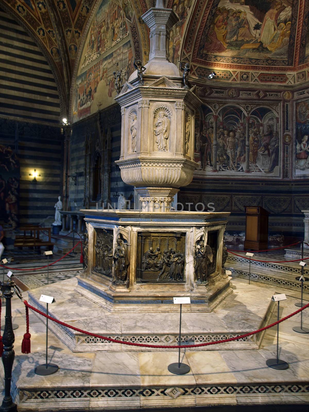Siena - baptismal font situated in the central place of the Baptistery