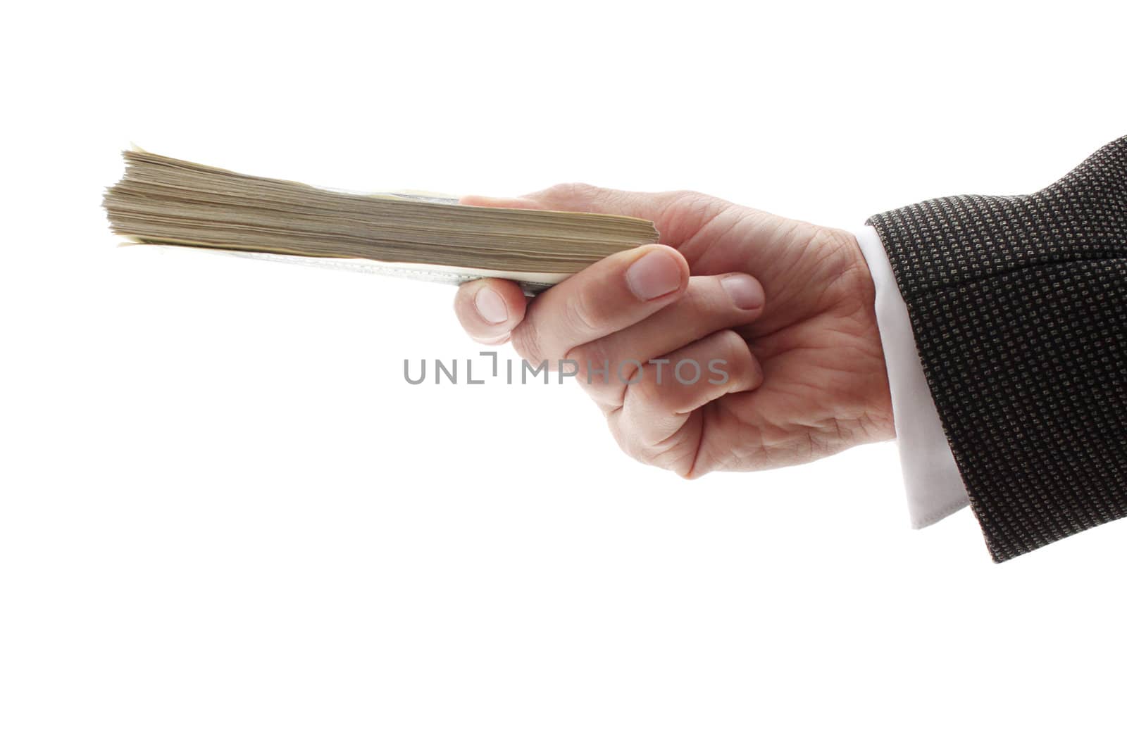 hand of businessman holding pile of dollars