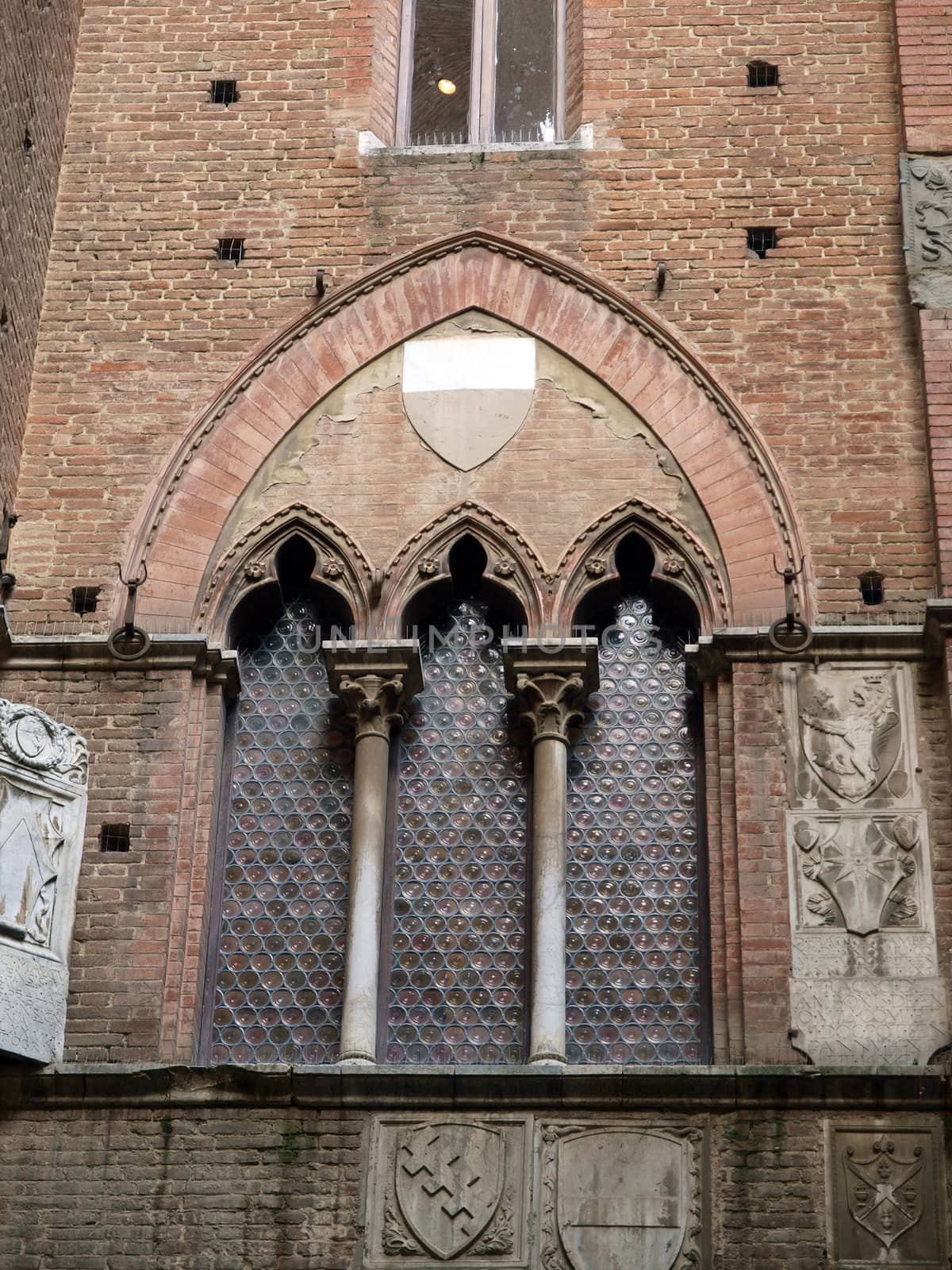 Wall of the courtyard in Palazzo Pubblico. Siena, Tuscany