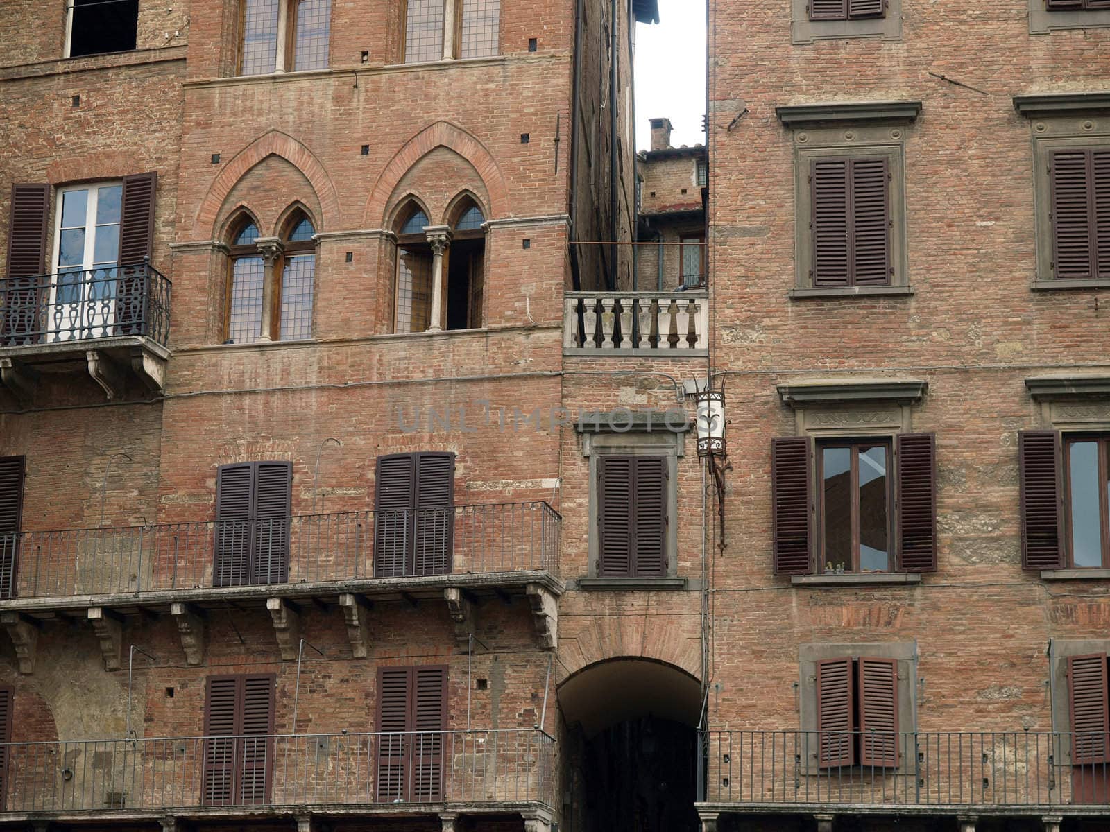 Siena - brick facades of Gothic buildings at Piazza Del Campo
