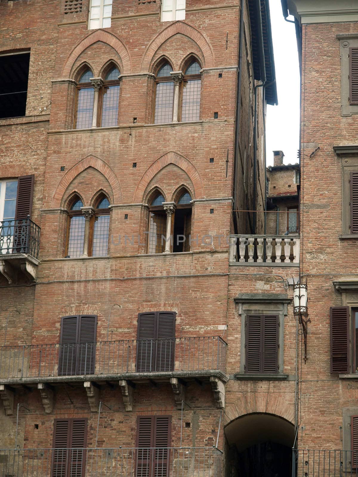 Siena - brick facades of Gothic buildings at Piazza Del Campo
