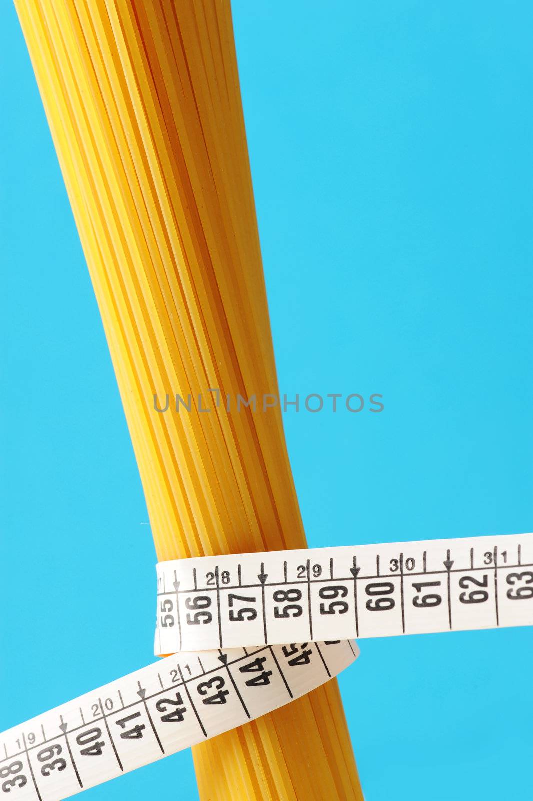 diet concept, Spaghetti with measuring tape  by stokkete