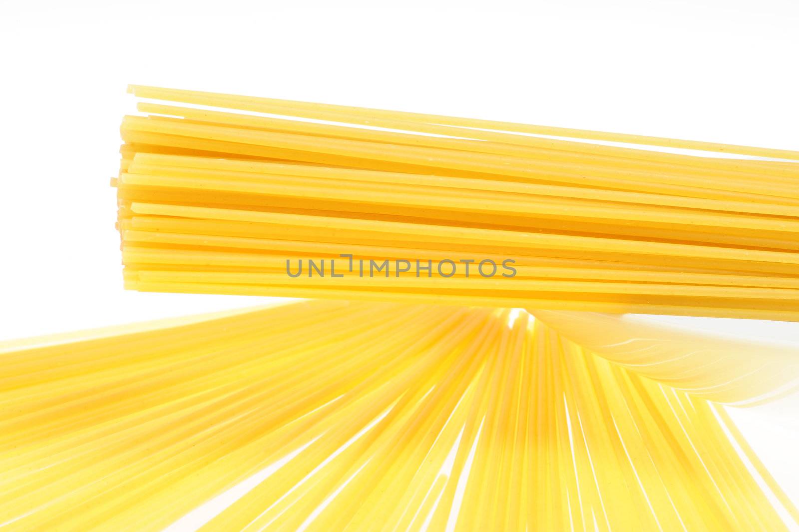 Mediterranean diet . Italian pasta, uncooked spaghetti by stokkete