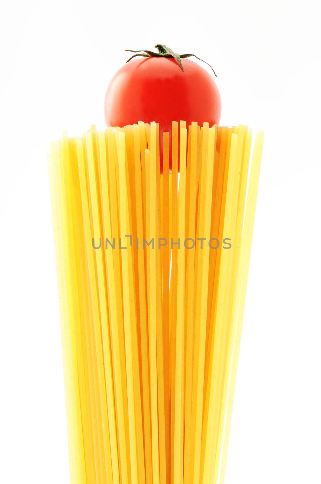 uncooked spaghetti noodles . Italian pasta with tomatoes