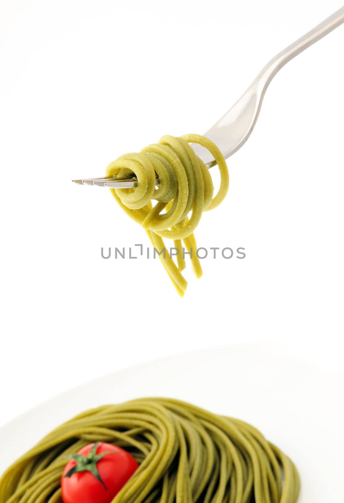 fresh spaghetti on fork close up shoot