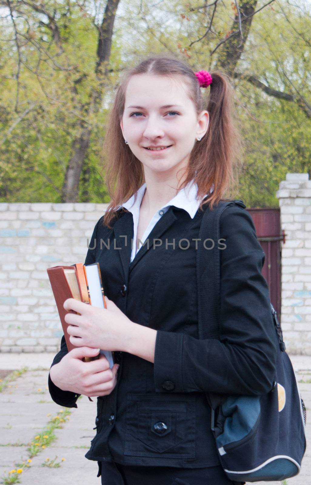 Teen girl staying outdoors at summer time