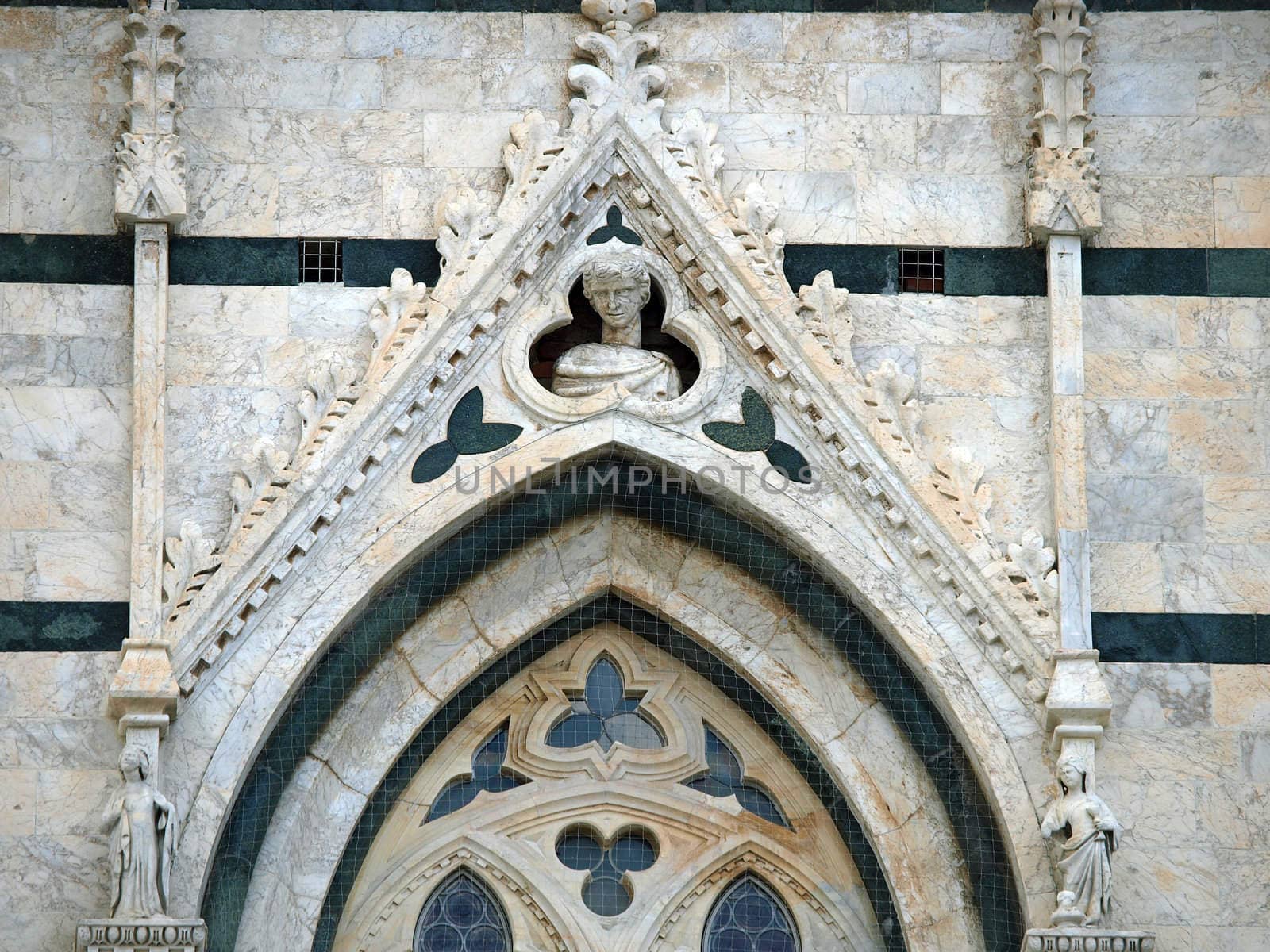 Architectural details of Duomo - Siena,Tuscany,Italy. The Duomo of Siena, which was built in the 12th and 13th centuries, is one of the prettiest churches in Gothic style in Italy
