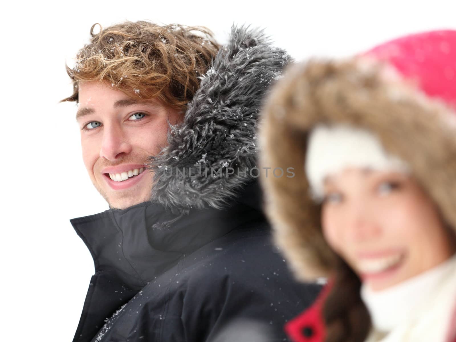 Outdoor couple smiling in winter snow by Maridav