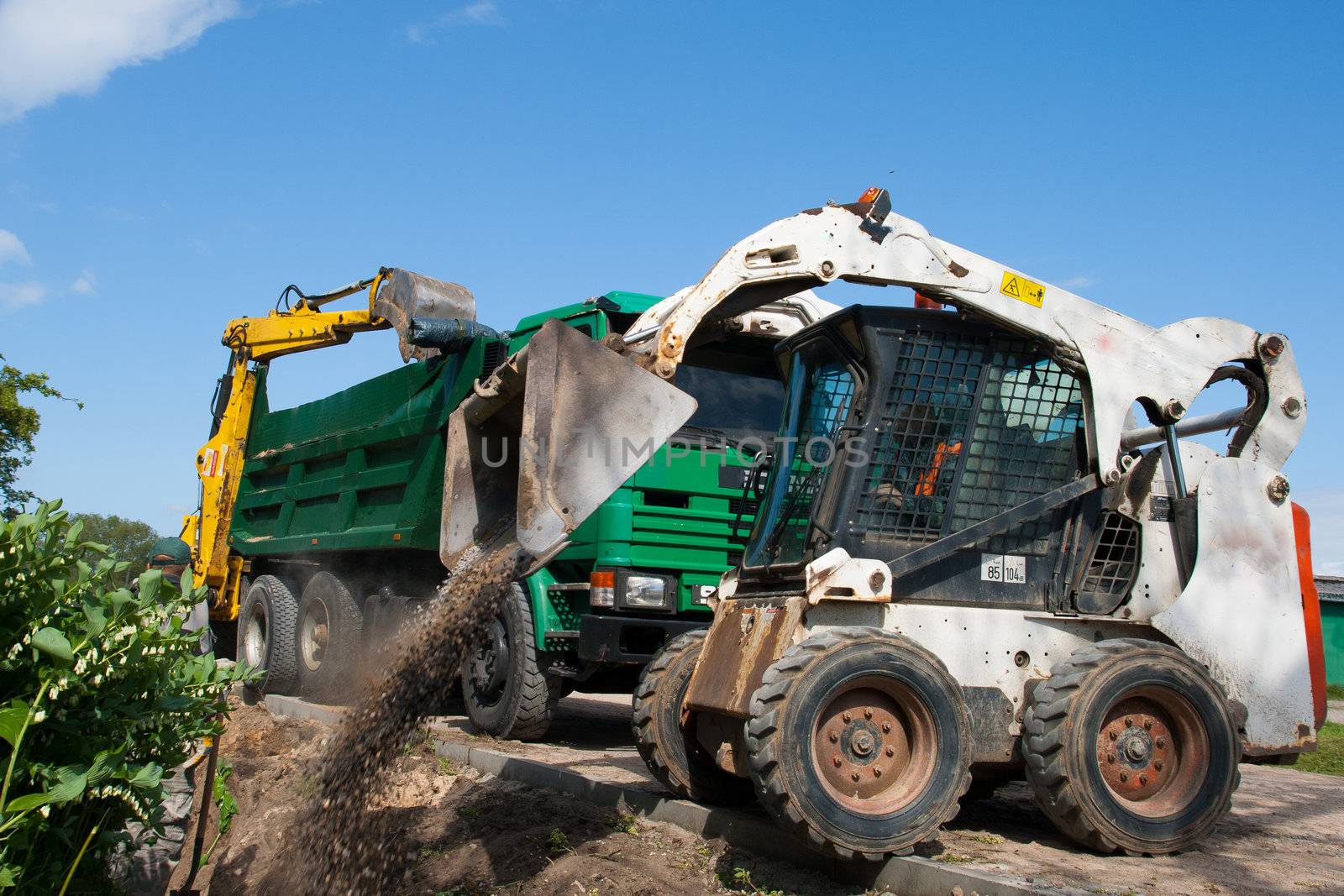 Mini Bobcat work on a street reconstruction