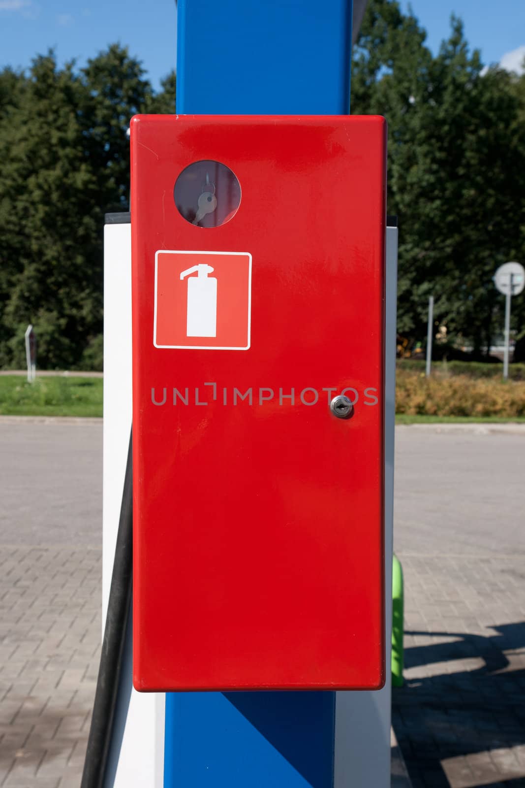 red emergency box on blue culomn