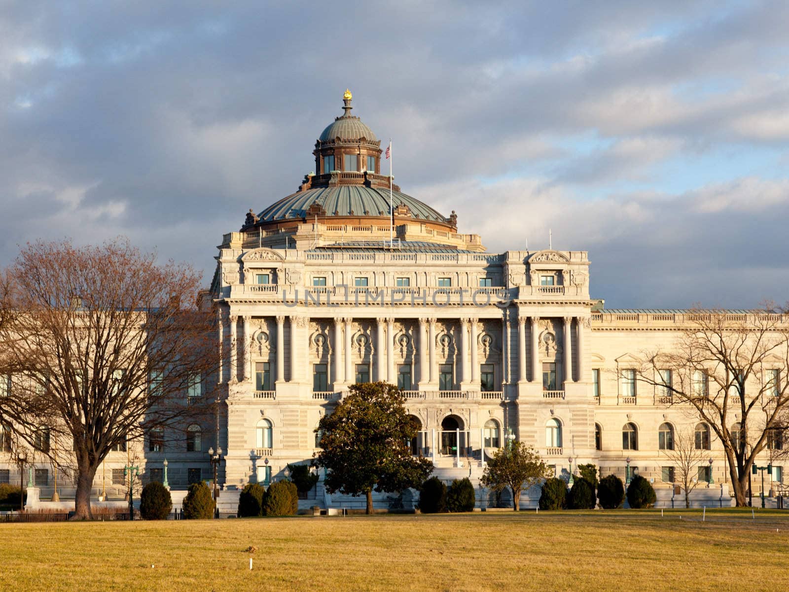 The setting sun lights up the US Library of Congress with warm light in late afternoon
